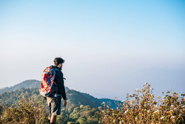 Man traveling with backpack hiking in mountains  - Photo, Image
