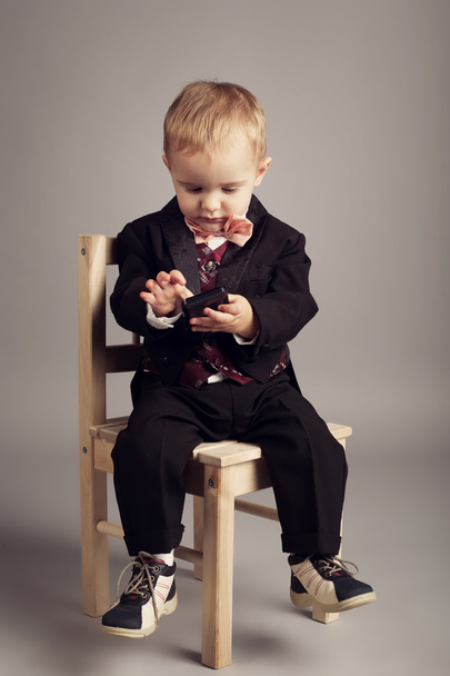 Little businessman with mobile phone - Фото, изображение