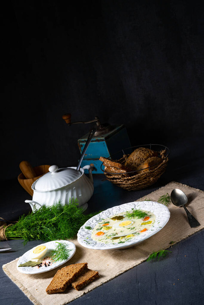Dill soup with potato, fresh dill and egg - 写真・画像
