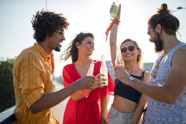 Group of happy friends having fun time at music festival - Photo, Image