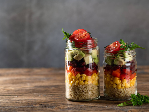quinoa salad in a jar on a dark background - Foto, Imagen
