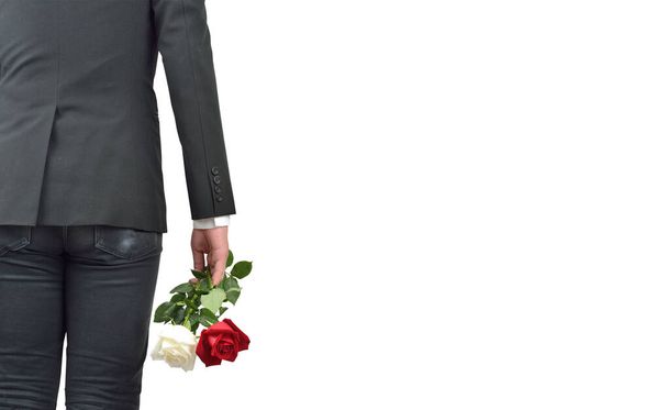 Young man with red white rose. Back view.  - 写真・画像