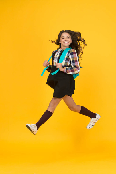 Break into next academic year. Backpack fashion accessory. Girl cheerful face carry backpack. Daily school life. Inspired for studying. Teen fashion. Schoolgirl modern clothes with cute backpack - 写真・画像