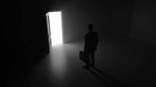 3d render Un uomo d'affari cammina attraverso una porta splendente in una stanza buia - Foto, immagini