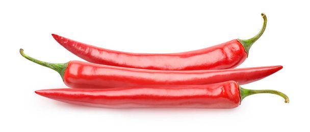 Pile of three red chili peppers isolated on white background - Photo, Image