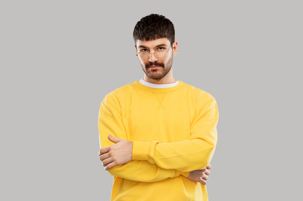 young man in glasses and yellow sweatshirt - Valokuva, kuva