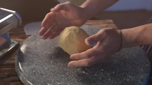Hands prepare the dough. Chef preparing homemade pasta dough in slow motion. Food video. Making pasta dough - Footage, Video