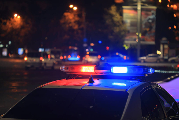 police car at night in cit - 写真・画像