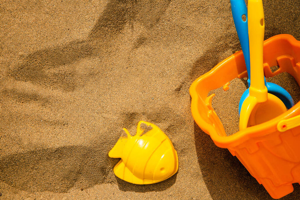 Children's beach toys on sand - 写真・画像