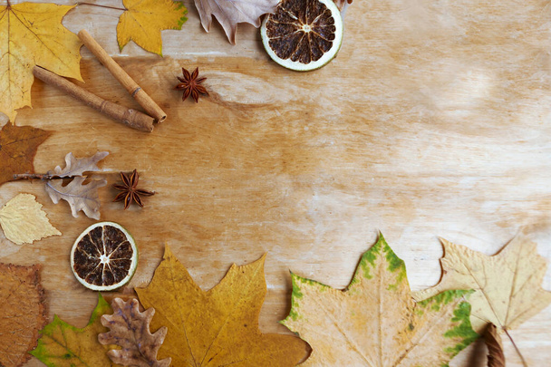 Autumn Background with Candied Oranges, Spices and Foliage. Thanksgiving Concept - Фото, зображення