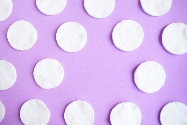 Cotton sponges pattern on purple background, minimal concept, copy space - Fotoğraf, Görsel