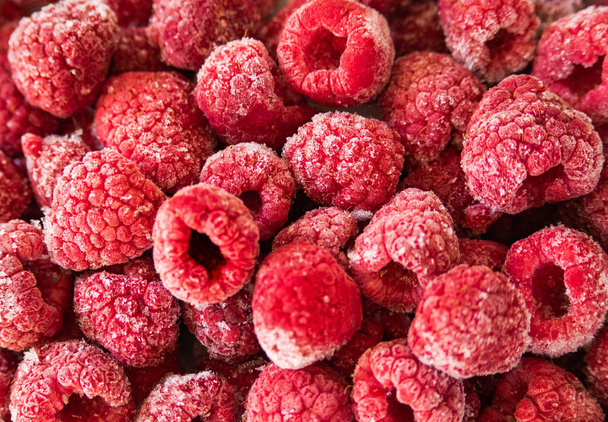 background of frozen pink raspberries - Foto, Imagem