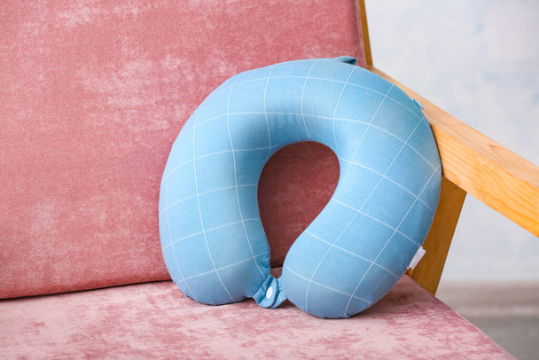 Travel pillow in armchair at home - Photo, Image