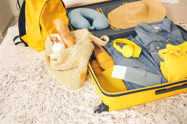 Packed suitcase on bed. Travel concept - Photo, Image