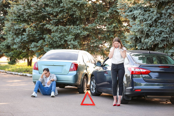 Stressed drivers near broken cars after accident - Photo, Image