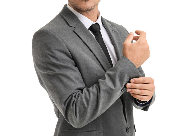 Fiatal üzletember elegáns öltöny fehér háttér - Fotó, kép