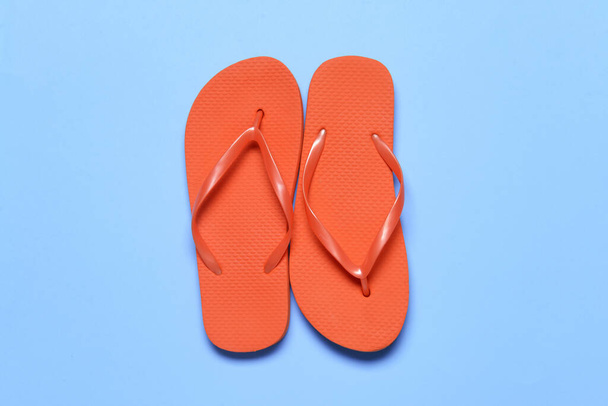 Stylish flip-flops on color background - Photo, image