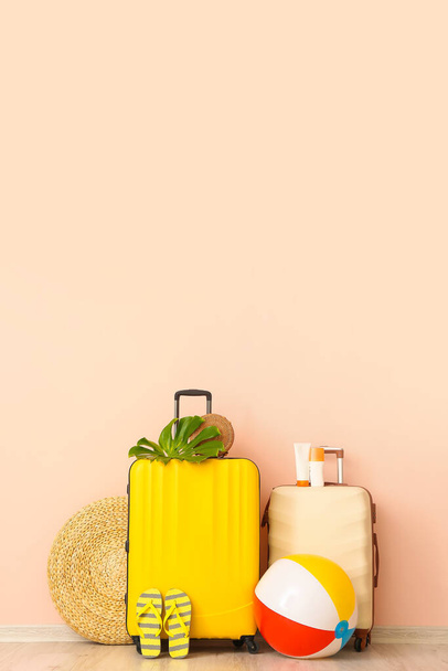 Packed luggage near color wall. Travel concept - Foto, imagen