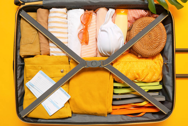 Packed luggage on color background. Travel concept - Photo, Image