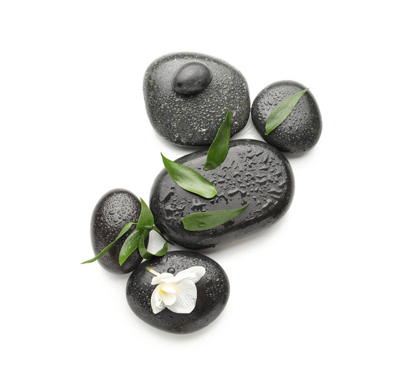 Spa stones and flower on white background - Foto, imagen
