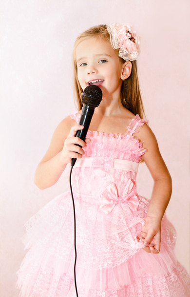 Beautiful little girl with microphone in princess dress - Foto, Imagem