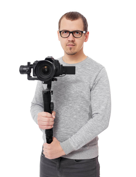 professional videographer holding camera on 3-axis gimbal isolated on white background - Photo, Image