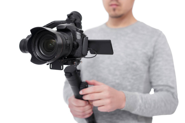 close up of modern dslr camera on 3-axis gimbal stabilizer in videographer hands isolated on white background - Photo, Image