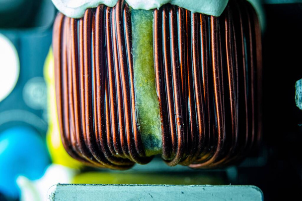 A closeup of the inductor of a computer under the lights with a blurry background - Photo, image