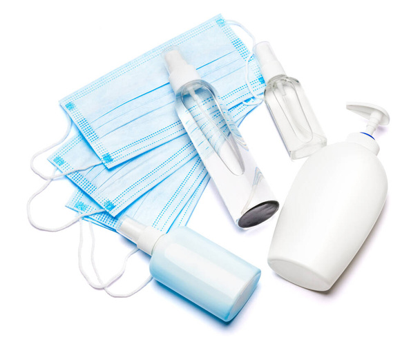 bottle of cream, lotion, sanitizer or liquid soap and protective mask isolated on white background - Foto, Imagem
