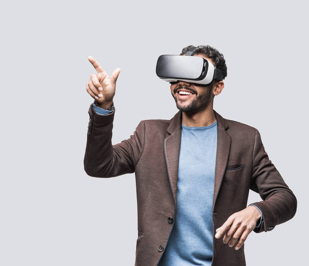 Young man using virtual reality headset, VR, future, gadgets, technology concept - Photo, Image