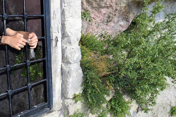 rusty iron window with old stone wall - Fotografie, Obrázek
