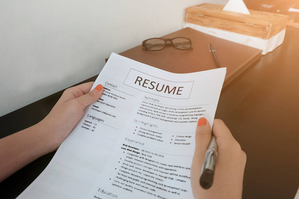 Close-up Photo Of A Businesswoman Holding Resume - Photo, Image