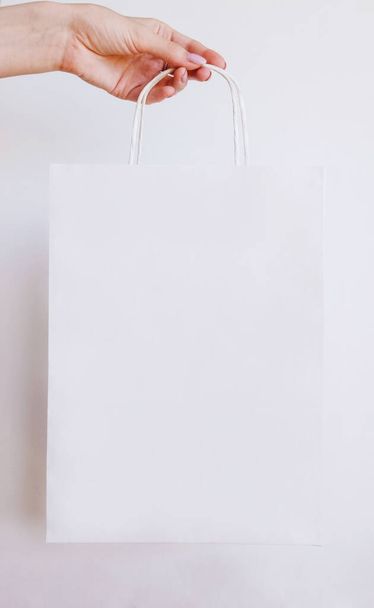 Paper bag on light background. Mockup for design - Zdjęcie, obraz