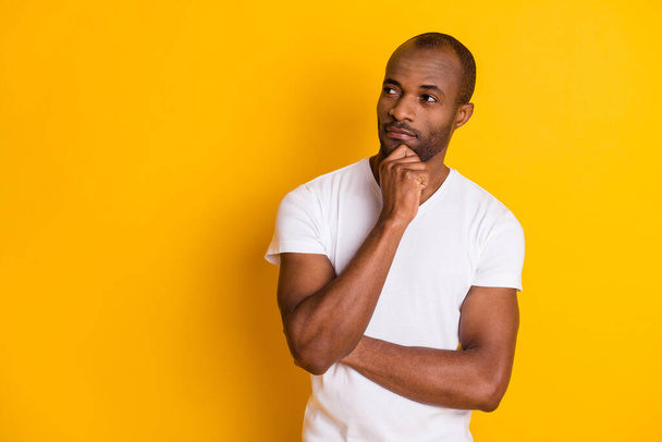 Portrait minded interested afro american guy touch hand chin look copyspace think thoughts decide decision choose choice solution wear casual style outfit isolated vivid color background - Photo, Image