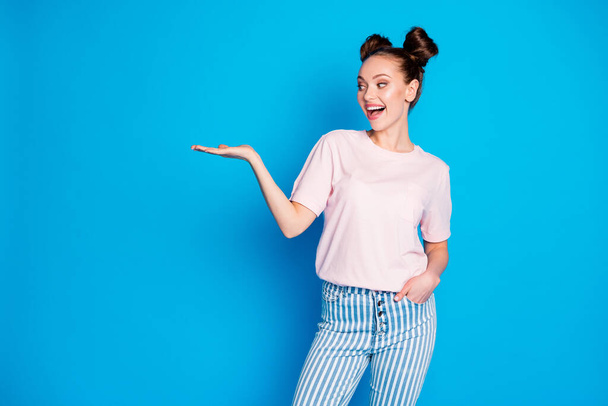 Portrait of her she nice-looking attractive pretty lovely cheerful cheery glad girl holding on palm copy empty blank space place isolated on bright vivid shine vibrant blue color background - Foto, immagini