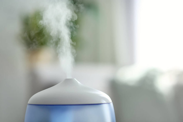 Modern air humidifier indoors, closeup. Space for text - Photo, image