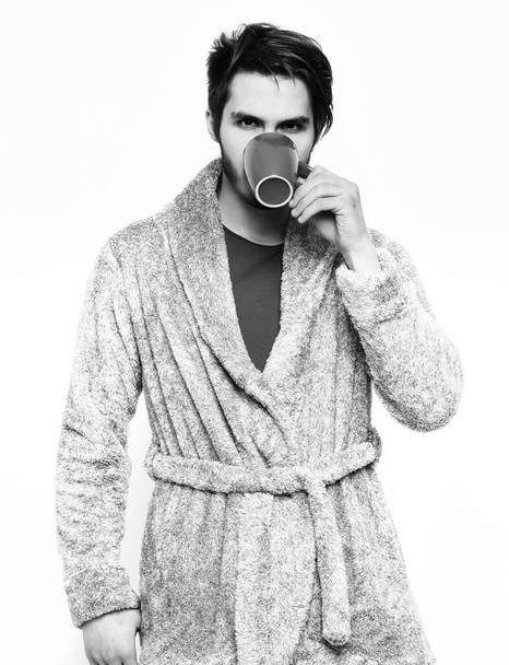 handsome bearded man with cup in terry bathrobe - Zdjęcie, obraz