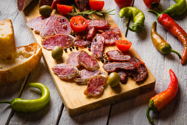 Cured pork and beef sausages served as tapas or antipasto cold buffet food - Zdjęcie, obraz