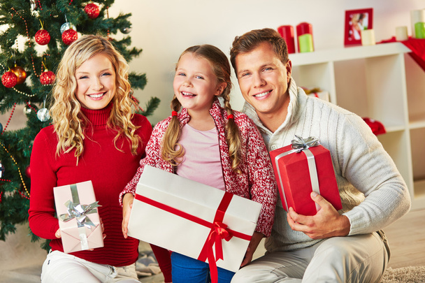 Family with giftboxes - Foto, Bild
