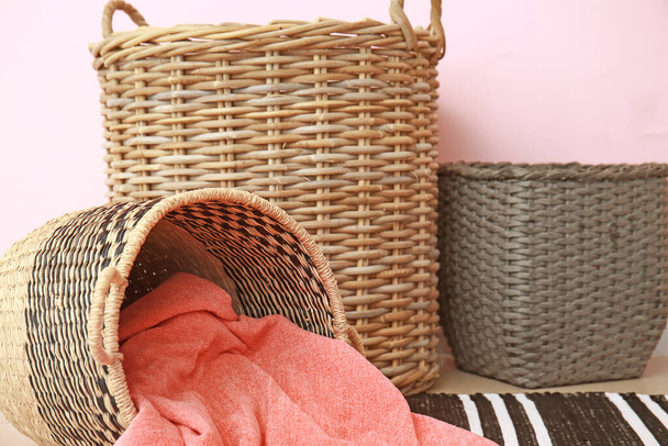 Wicker baskets with plaid in room - Photo, Image
