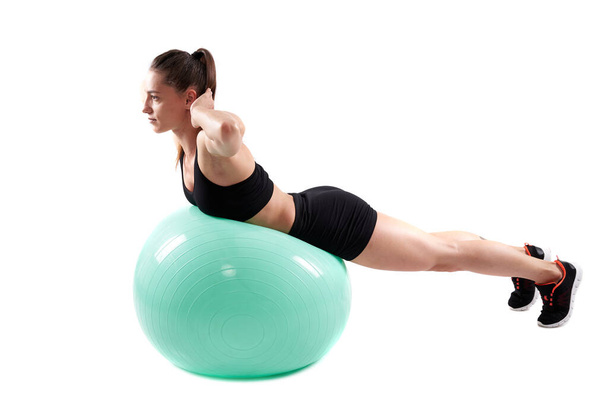 Fitness girl doing working out with gym ball - Foto, imagen