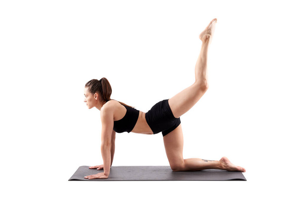 Woman yoga trainer in various poses (asana) isolated on white background - Foto, Imagem