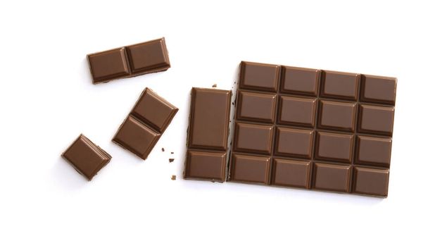 Chocolate pieces isolated on white background from top view - Foto, immagini