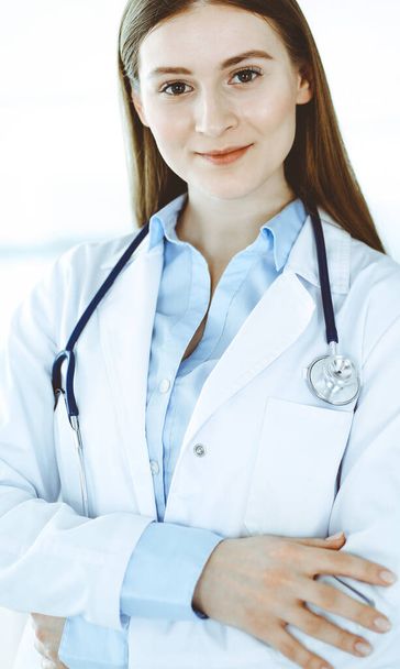 Doctor woman standing straight with arms crossed, portrait. Perfect medical service in clinic. Medicine and healthcare concepts - Photo, image