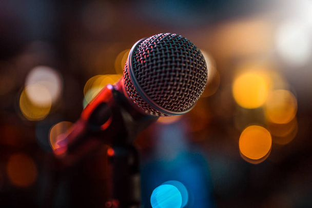 close-up stage microphone with blurry lights in the background - Photo, Image