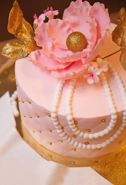 Celebratory cake decorated with a flower. - Photo, Image