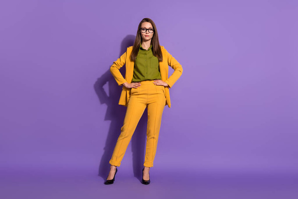 Full body photo of cool charming business lady hold hands waist ready decide solution wear good look classy outfit isolated over vivid color background - Photo, Image