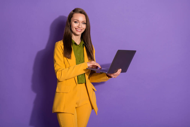 Photo of beautiful business lady successful worker online meeting distance work stay home quarantine wear yellow blazer trousers suit blouse shirt isolated purple pastel color background - Foto, Imagen