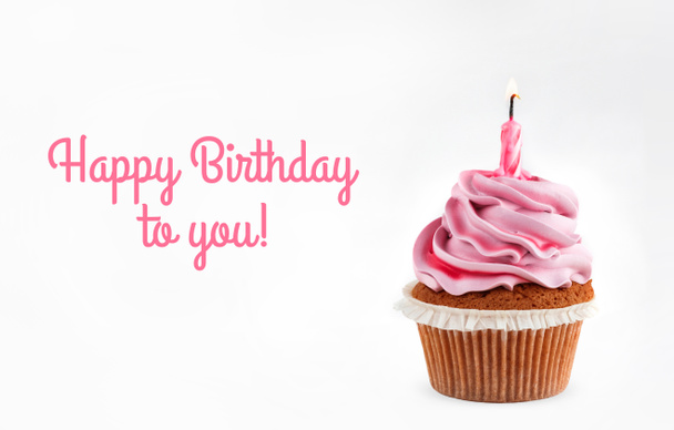 Tasty pink cupcake with candle on white background with text Happy Birthday to you. Holiday cake celebration, close up - Photo, Image