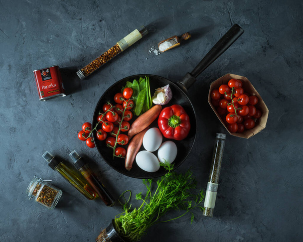 Raw vegetables, eggs, herbs for cooking shakshuka, top view - Photo, Image